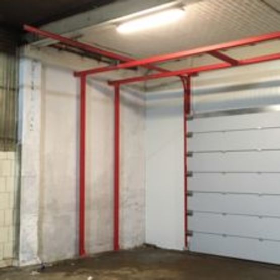  Porte sectionnelle acoustique sur mesure avec option coupe-feu | NOISE LOCK 47 dB - Portes PF REI 90/120