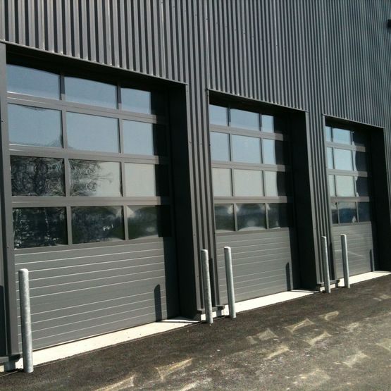  Portes sectionnelles à tablier aluminium ou acier | Isotec  Thermotec  Cristal - Porte sectionnelle à panneau rigide