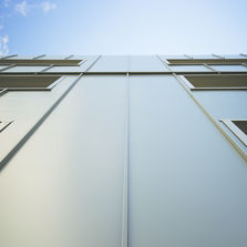 Façades en panneaux isolants à effet joint-debout | ITE