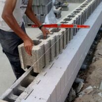 Bloc de coffrage isolant en béton bois/ciment à isolation extérieure associée | ISOLABLOC